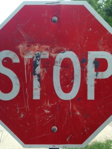 Battered STOP sign